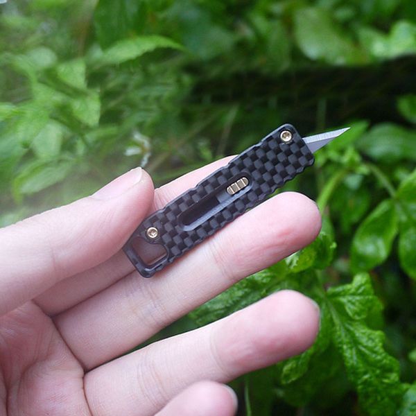 mini portable carbon fiber handle cutter key chain knife utility knife outdoor survival self-defense gear tool
mini portable carbon fiber handle cutter key chain knife utility knife outdoor survival self-defense gear tool