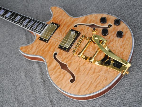 custom 339 semi hollow body natural quilted maple jazz electric guitar double f holes, bigs tremolo, dual body binding, tuilp tuners
custom 339 semi hollow body natural quilted maple jazz electric guitar double f holes, bigs tremolo, dual body binding, tuilp tuners