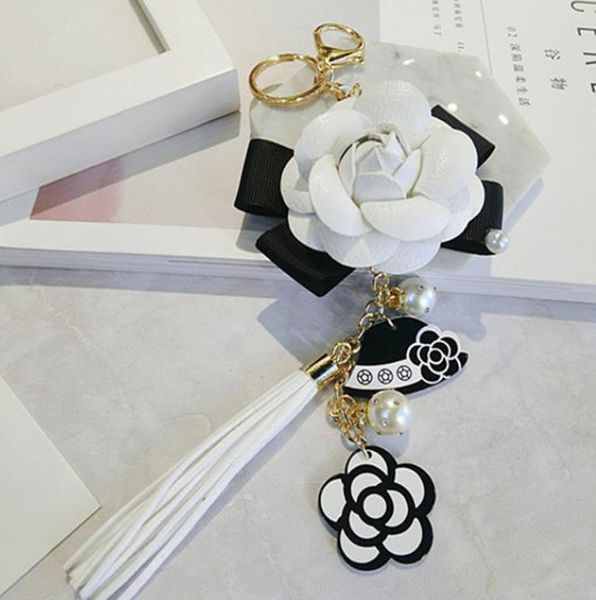 genuine leather black&white male&female keychain bag plush car key ring car key camellia flower hat tassel style key chain246v, Silver
genuine leather black&white male&female keychain bag plush car key ring car key camellia flower hat tassel style key chain246v, Silver
