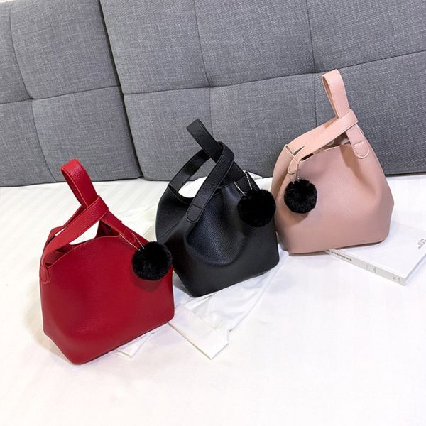 ladies new fashion solid color hair ball pendant ladies bucket handbag trend simple and stylish pu messenger shoulder bag
ladies new fashion solid color hair ball pendant ladies bucket handbag trend simple and stylish pu messenger shoulder bag