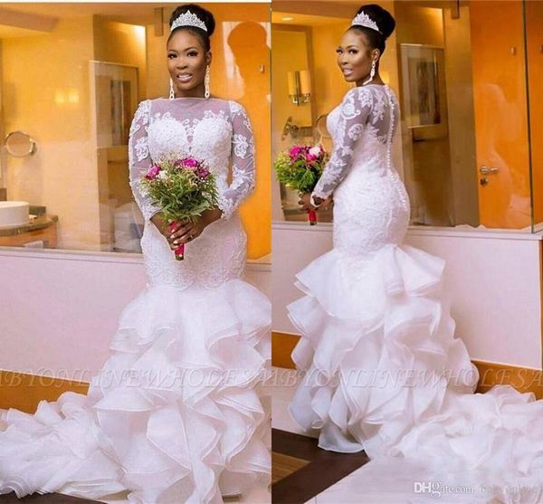 african white mermaid wedding dresses jewel illusion long sleeve appliqued sheer neck cascading ruffle long bridal gowns vestidos de soiree
african white mermaid wedding dresses jewel illusion long sleeve appliqued sheer neck cascading ruffle long bridal gowns vestidos de soiree