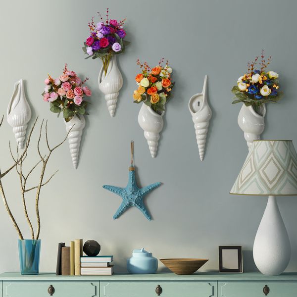 simple modern creative mural wall vase restaurant home decoration accessories conch shaped vase arts and crafts
simple modern creative mural wall vase restaurant home decoration accessories conch shaped vase arts and crafts
