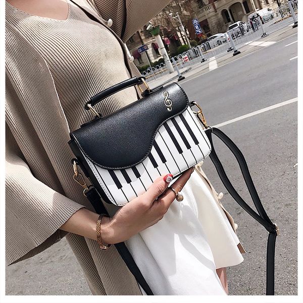 2020 new style piano women's bag fashion shoulder strap keys small square bag women's
2020 new style piano women's bag fashion shoulder strap keys small square bag women's