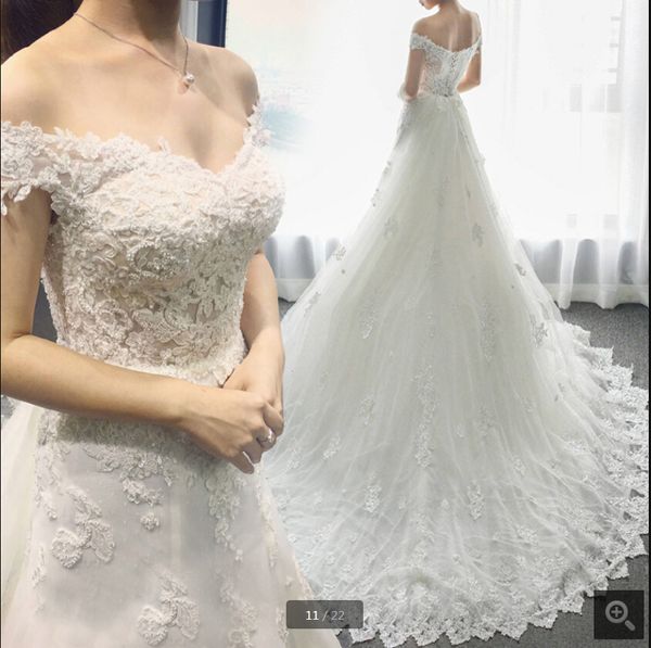 2020 real picture white summer beach wedding dress lace appliques off the shoulder v neck beaded wedding gowns selling court train 
2020 real picture white summer beach wedding dress lace appliques off the shoulder v neck beaded wedding gowns selling court train