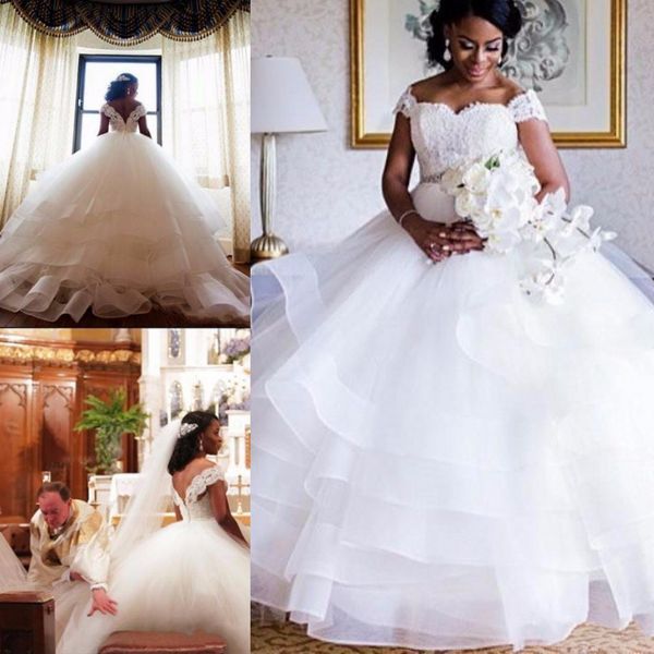 2020 african tiered ruffles ball gown wedding dresses white sweetheart cap sleeves wedding gowns with beading belt sweep train bridal gowns
2020 african tiered ruffles ball gown wedding dresses white sweetheart cap sleeves wedding gowns with beading belt sweep train bridal gowns