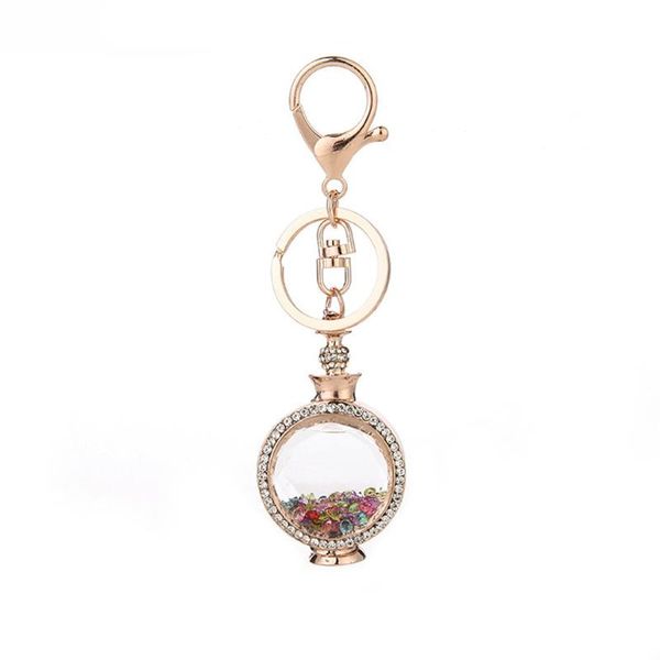 new design fashion metal crystal perfume bottle keychain creative elegant bag car keychains gift valentine's day gift for lover, Silver
new design fashion metal crystal perfume bottle keychain creative elegant bag car keychains gift valentine's day gift for lover, Silver