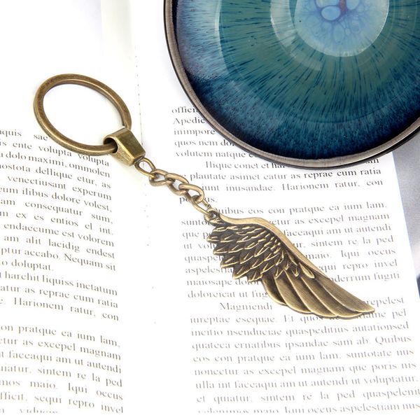 vintage engraved wing keychain with key ring for handbag bag decor, Silver 
vintage engraved wing keychain with key ring for handbag bag decor, Silver