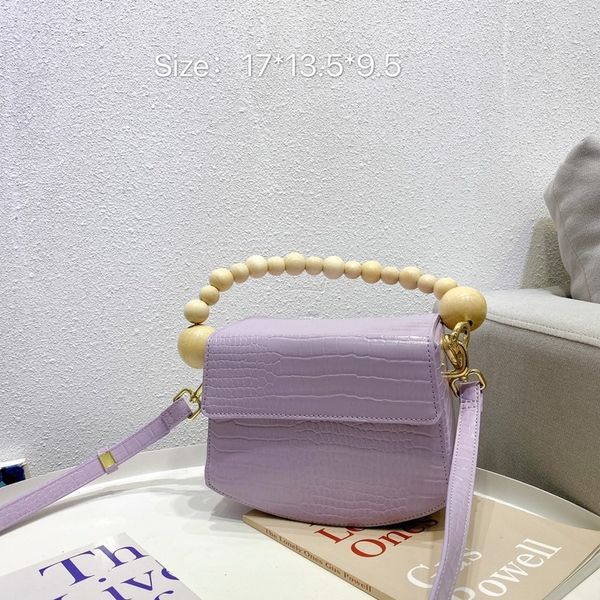 2020 summer new wood beaded handle crossbody bag retro square sling women's bag portable shoulderbag pu solid color saddle
2020 summer new wood beaded handle crossbody bag retro square sling women's bag portable shoulderbag pu solid color saddle