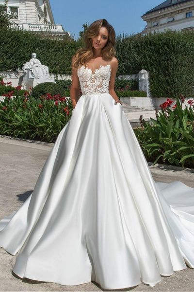 simple design a line satin wedding dresses illusion 2020 sheer neck v cut backless bridal gown with pockets lace long train vestidos, White 
simple design a line satin wedding dresses illusion 2020 sheer neck v cut backless bridal gown with pockets lace long train vestidos, White