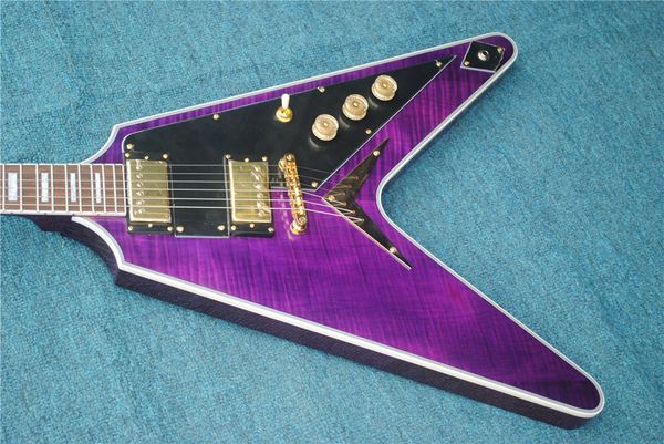 custom trans purple flame maple flying v electric guitar string thru body bridge, black pickguard, gold hardware, white mop block inlay
custom trans purple flame maple flying v electric guitar string thru body bridge, black pickguard, gold hardware, white mop block inlay