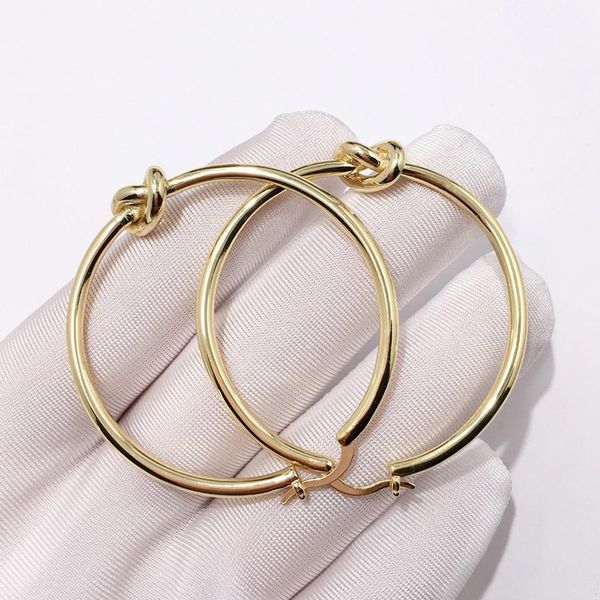 european and american personality copper plated gold shiny knotted beautiful round earrings knotted earrings large big hoop earrings, Golden
european and american personality copper plated gold shiny knotted beautiful round earrings knotted earrings large big hoop earrings, Golden