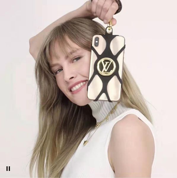 luxury phone holder designer phone case lanyard silicone holder gold-color hardware embossed gold-color metal brand logo motif
luxury phone holder designer phone case lanyard silicone holder gold-color hardware embossed gold-color metal brand logo motif