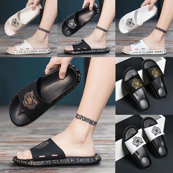 kanye west slippers black white resin desert sand designer slippers summer tiger head flat slide men beach causal sandals
kanye west slippers black white resin desert sand designer slippers summer tiger head flat slide men beach causal sandals