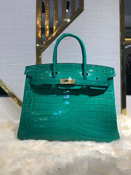 whosale green rocodile leather design handbag,fully handmade with wax thread,gold and silver hardware,by order, fast delivery
whosale green rocodile leather design handbag,fully handmade with wax thread,gold and silver hardware,by order, fast delivery