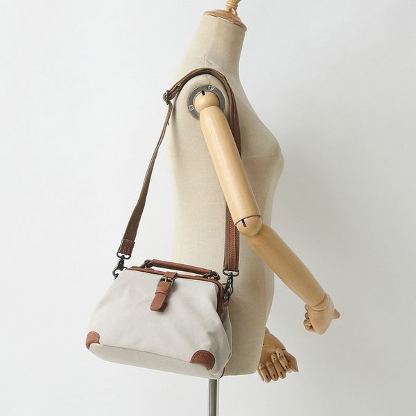 original retro forest female canvas bag with leather bucket shoulder bag portable diagonal clip
original retro forest female canvas bag with leather bucket shoulder bag portable diagonal clip