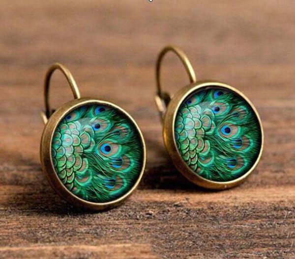 vintage peacock feathers time gem earrings antique bronze silver print feather pattern round eardrop women ear hooked ear stud jewelry gifts
vintage peacock feathers time gem earrings antique bronze silver print feather pattern round eardrop women ear hooked ear stud jewelry gifts