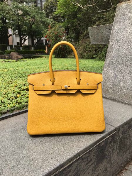 whosale fully handmade yellow togo leather design purse 30cm,wax thread,also have other size, have both gold and silver hardware
whosale fully handmade yellow togo leather design purse 30cm,wax thread,also have other size, have both gold and silver hardware