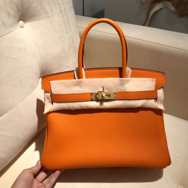 wholesale,half handmade togo leather orange design purse30cm,also have size 25 35cm,wax thread,have gold and silver hardware,fast delivery
wholesale,half handmade togo leather orange design purse30cm,also have size 25 35cm,wax thread,have gold and silver hardware,fast delivery