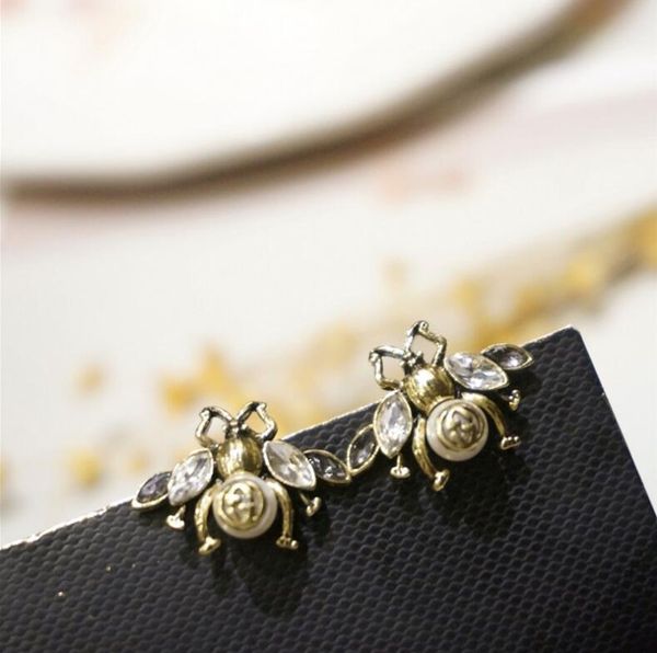 925 silver needle korean design sense pearl bronze zircon flash drill bee wild fashion earrings female b11, Golden;silver
925 silver needle korean design sense pearl bronze zircon flash drill bee wild fashion earrings female b11, Golden;silver