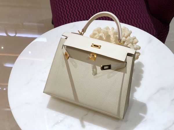 whosale half handmade cream white 25cm epsom leather design purse, wax thread, have both gold and silver hardware,contact me for details
whosale half handmade cream white 25cm epsom leather design purse, wax thread, have both gold and silver hardware,contact me for details