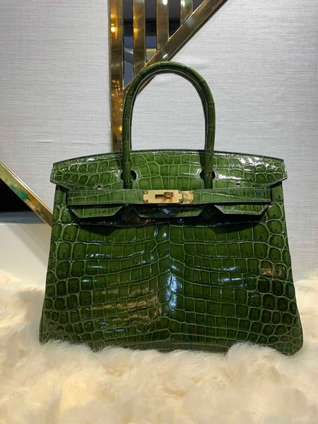 whosale shiny army green crocodile leather design purse 30cm,fully handmade with wax thread,gold and silver hardware,by order, fast delivery
whosale shiny army green crocodile leather design purse 30cm,fully handmade with wax thread,gold and silver hardware,by order, fast delivery