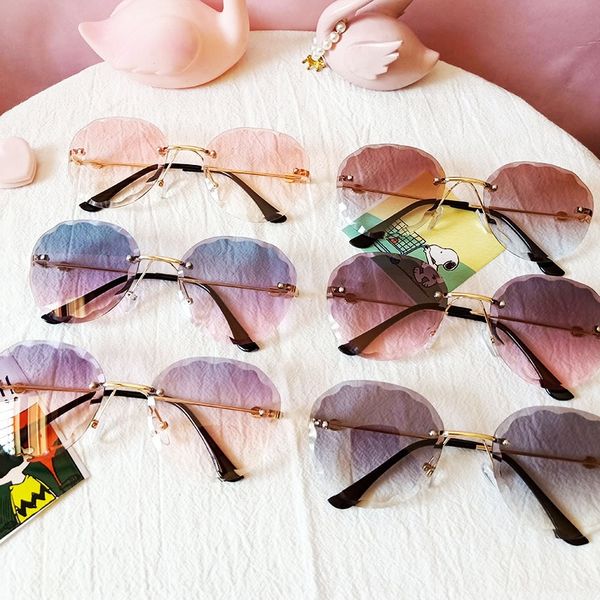 children's new frameless trimming gradient brown round clam sun glasses transparent male and female baby sun glasses, Blue
children's new frameless trimming gradient brown round clam sun glasses transparent male and female baby sun glasses, Blue