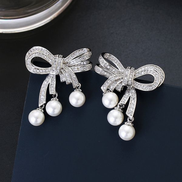 stud bow-knot earrings with pearl cz stones paved copper gold plating xiumeiyizu jewelry wholesale, Golden;silver
stud bow-knot earrings with pearl cz stones paved copper gold plating xiumeiyizu jewelry wholesale, Golden;silver