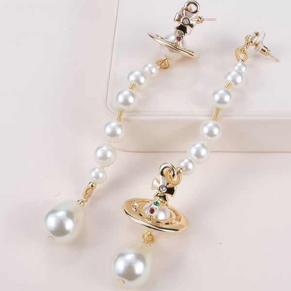 european and american queen mother vw vivienne vivienne asymmetrical pearl three-dimensional saturn earring pendant nana punk, Silver
european and american queen mother vw vivienne vivienne asymmetrical pearl three-dimensional saturn earring pendant nana punk, Silver