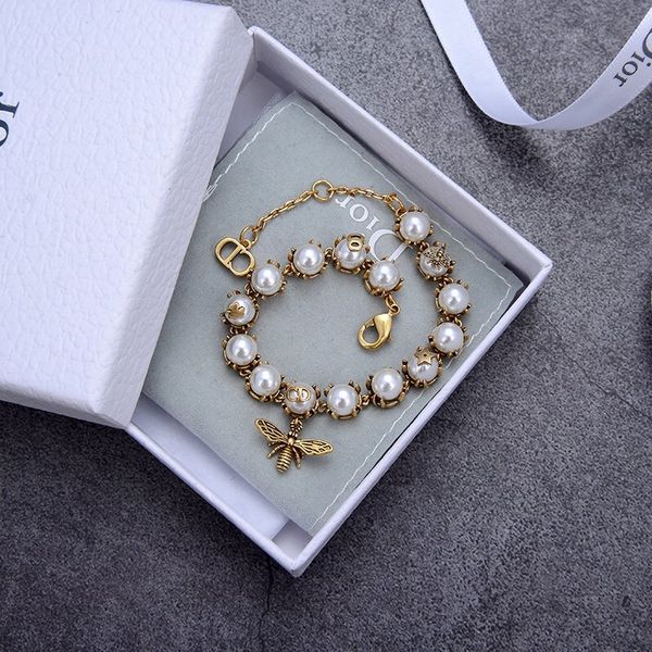 european and american fashion new popular selling letter pearl open designer bracelet with box bee pearl bracelet 34, Golden;silver
european and american fashion new popular selling letter pearl open designer bracelet with box bee pearl bracelet 34, Golden;silver