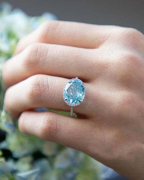 cluster rings trendy sky blue cubic zircon ring female fashion big stone for women engagement wedding jewelry gift, Golden;silver 
cluster rings trendy sky blue cubic zircon ring female fashion big stone for women engagement wedding jewelry gift, Golden;silver