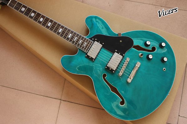 custom shop.f hollow body jazz electric guitar.green color guitarra.rosewood fingerboard,black pickguard gitaar
custom shop.f hollow body jazz electric guitar.green color guitarra.rosewood fingerboard,black pickguard gitaar