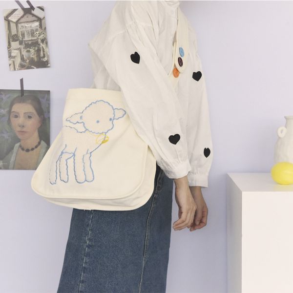 cute double-sided embroidered lamb wild soft cute messenger bag shoulder strap button adjustable shoulder bag
cute double-sided embroidered lamb wild soft cute messenger bag shoulder strap button adjustable shoulder bag