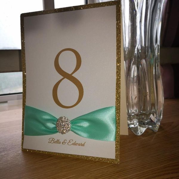 10pcs/lot personalized rhinestone brooch with ribbon decoration stand personalized table number thick glitter
10pcs/lot personalized rhinestone brooch with ribbon decoration stand personalized table number thick glitter