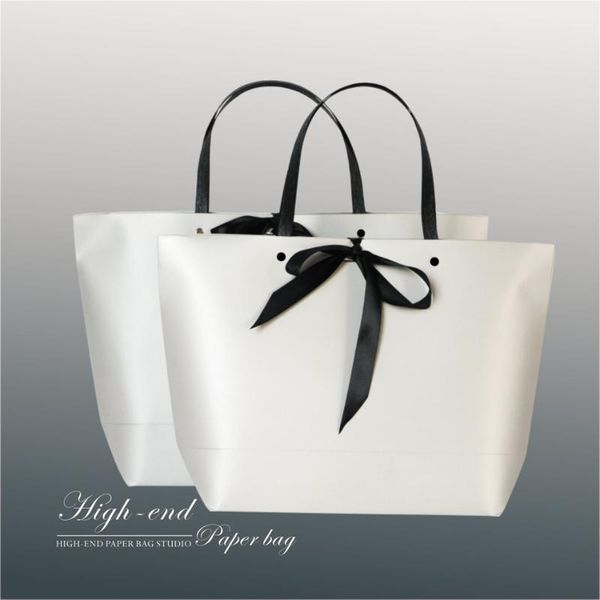 new arrive silver nailed clothing paper bag packaging bag gift creative handbag portable wedding with ribbion
new arrive silver nailed clothing paper bag packaging bag gift creative handbag portable wedding with ribbion