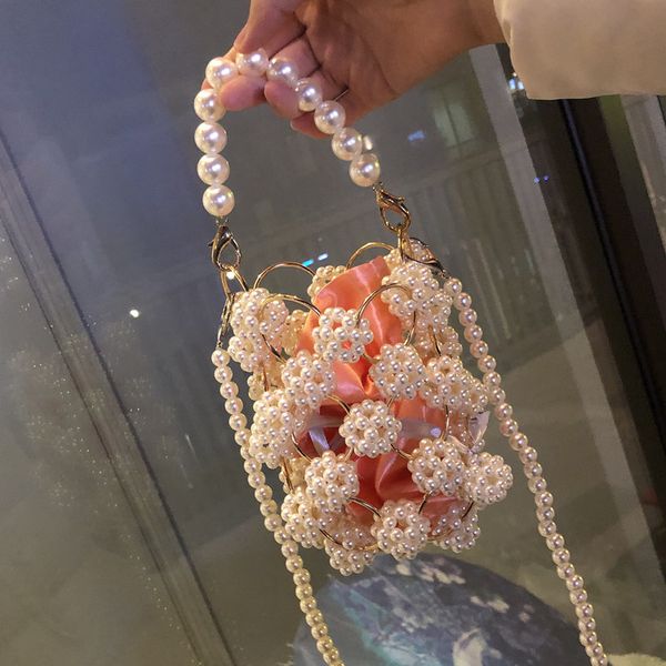 2020 push fairy style female bag flower hand-knitted pearl bag female 2020 new portable crossbody women
2020 push fairy style female bag flower hand-knitted pearl bag female 2020 new portable crossbody women