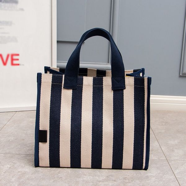2019 korean version of the sleek minimalist canvas bag art small striped handbags women's bags
2019 korean version of the sleek minimalist canvas bag art small striped handbags women's bags