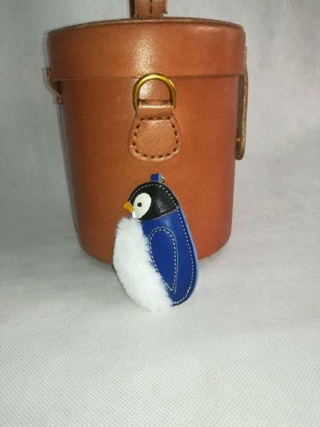 creative cute imitation plush penguin keychains hand layer coyote leather key chain bag pendant key ring, Silver
creative cute imitation plush penguin keychains hand layer coyote leather key chain bag pendant key ring, Silver