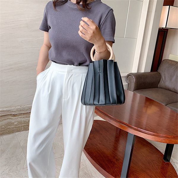 brand original design 2020 summer personality trend bucket bag wooden portable solid color handbag fold bag
brand original design 2020 summer personality trend bucket bag wooden portable solid color handbag fold bag