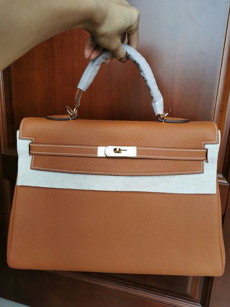 by order,wholesale,fully handmade togo leather design keily purse 35cm,wax thread,have gold and silver hardware,10-15days to make
by order,wholesale,fully handmade togo leather design keily purse 35cm,wax thread,have gold and silver hardware,10-15days to make