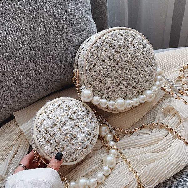 elegant female round pearl tote bag 2020 fashion new woolen women's designer handbag chain shoulder messenger bag
elegant female round pearl tote bag 2020 fashion new woolen women's designer handbag chain shoulder messenger bag