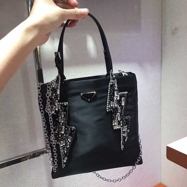 new tiled lady's handbag 7a high-end custom quality handbag fashion style silver metal accessories with detachable long shoulder strap.
new tiled lady's handbag 7a high-end custom quality handbag fashion style silver metal accessories with detachable long shoulder strap.
