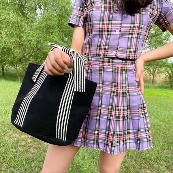 2020 new fashion simple stripe bow decoration casual portable wild canvas bag bucket bag messenger hand
2020 new fashion simple stripe bow decoration casual portable wild canvas bag bucket bag messenger hand