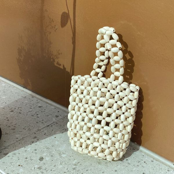 2020 new fashion vintage women wooden beads handbag woven hand bag lady retro bamboo beach hollow out shoulder messenger bag
2020 new fashion vintage women wooden beads handbag woven hand bag lady retro bamboo beach hollow out shoulder messenger bag