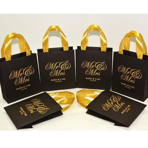 gift wrap personalized mr & mrs wedding welcome bags with satin ribbon and names, elegant black gold party favors for guests
gift wrap personalized mr & mrs wedding welcome bags with satin ribbon and names, elegant black gold party favors for guests