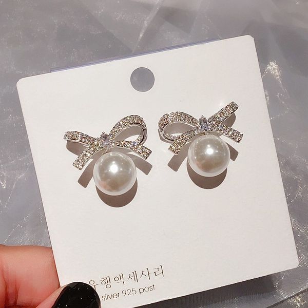 exquisite bowknot stud earrings micro paved cubic zirconia imitation pearl earrings fashion women jewelry, Golden;silver
exquisite bowknot stud earrings micro paved cubic zirconia imitation pearl earrings fashion women jewelry, Golden;silver