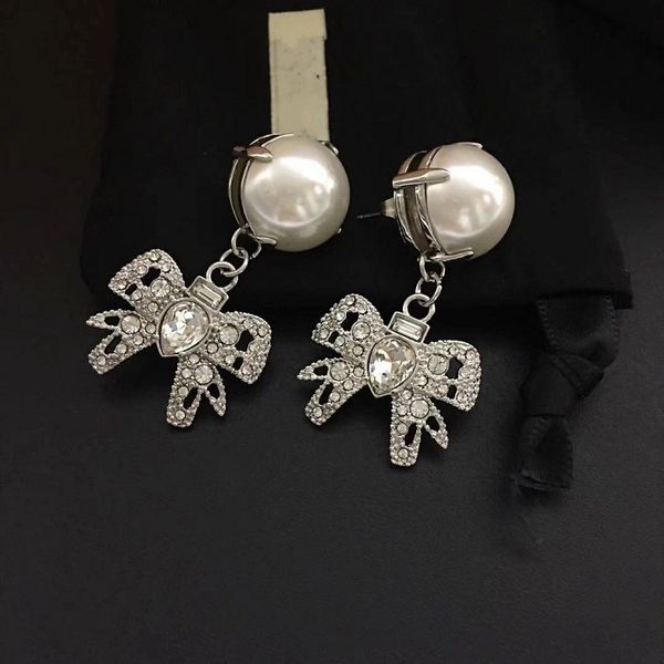 the new butterfly crystal pearl earrings with a hundred touches bow earrings, Silver
the new butterfly crystal pearl earrings with a hundred touches bow earrings, Silver