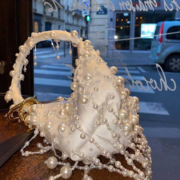 pearl bucket evening clutch bag women summer hollow out beading tassel handbag female fashion party wedding
pearl bucket evening clutch bag women summer hollow out beading tassel handbag female fashion party wedding