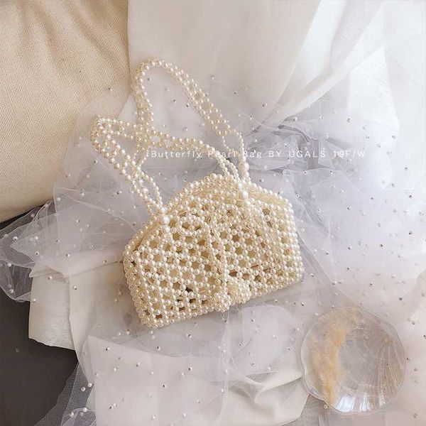 new вечера женщин tote сумки элегантная сумка new pearl crossbody сумка bow бисером дамы сумки на ремне женщины повседневная
new вечера женщин tote сумки элегантная сумка new pearl crossbody сумка bow бисером дамы сумки на ремне женщины повседневная