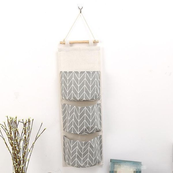 wall hanging organizer bags cotton linen holder storage bag door hanging sundry bags sundry sorting bags 3 pockets home supplies 
wall hanging organizer bags cotton linen holder storage bag door hanging sundry bags sundry sorting bags 3 pockets home supplies