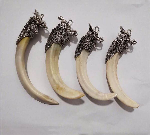 tibetan silver dragon head with boar tooth pendant, exquisite crafts, decorations, collectibles pendant
tibetan silver dragon head with boar tooth pendant, exquisite crafts, decorations, collectibles pendant